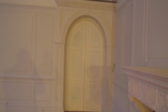 tofthallcheshiremdfwallpanellinglookingatsideoffireplaceandacrheddoorway